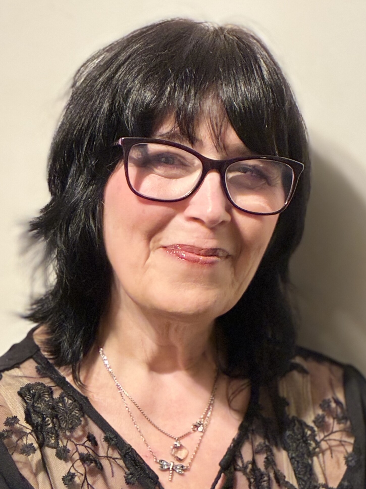 Dr. Cheryl Boyle, a white woman with shoulder length black hair and glasses.